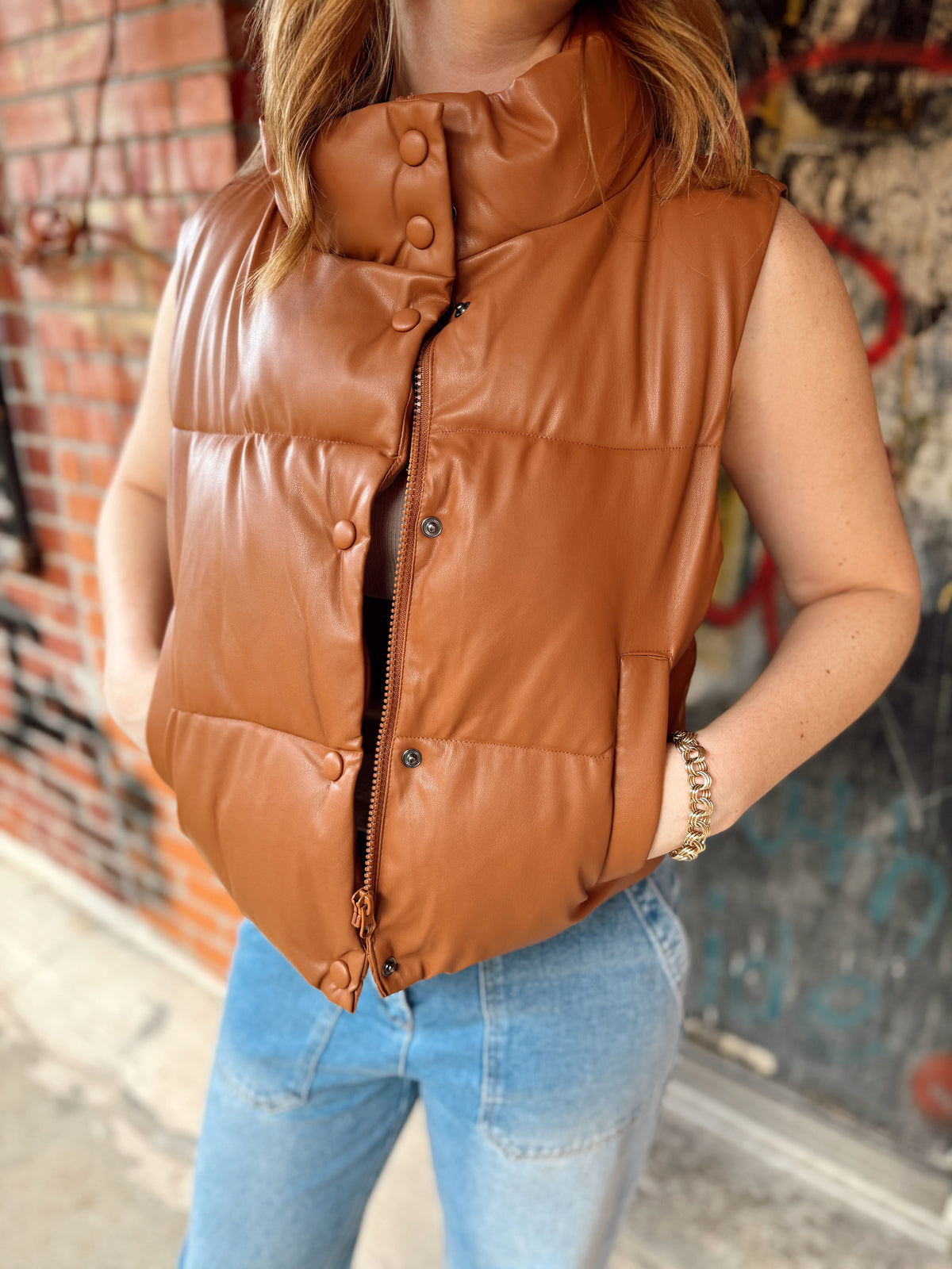 girl wearing puffer vest-puffer vest-vest-camel vest-button up vest-zip up vest